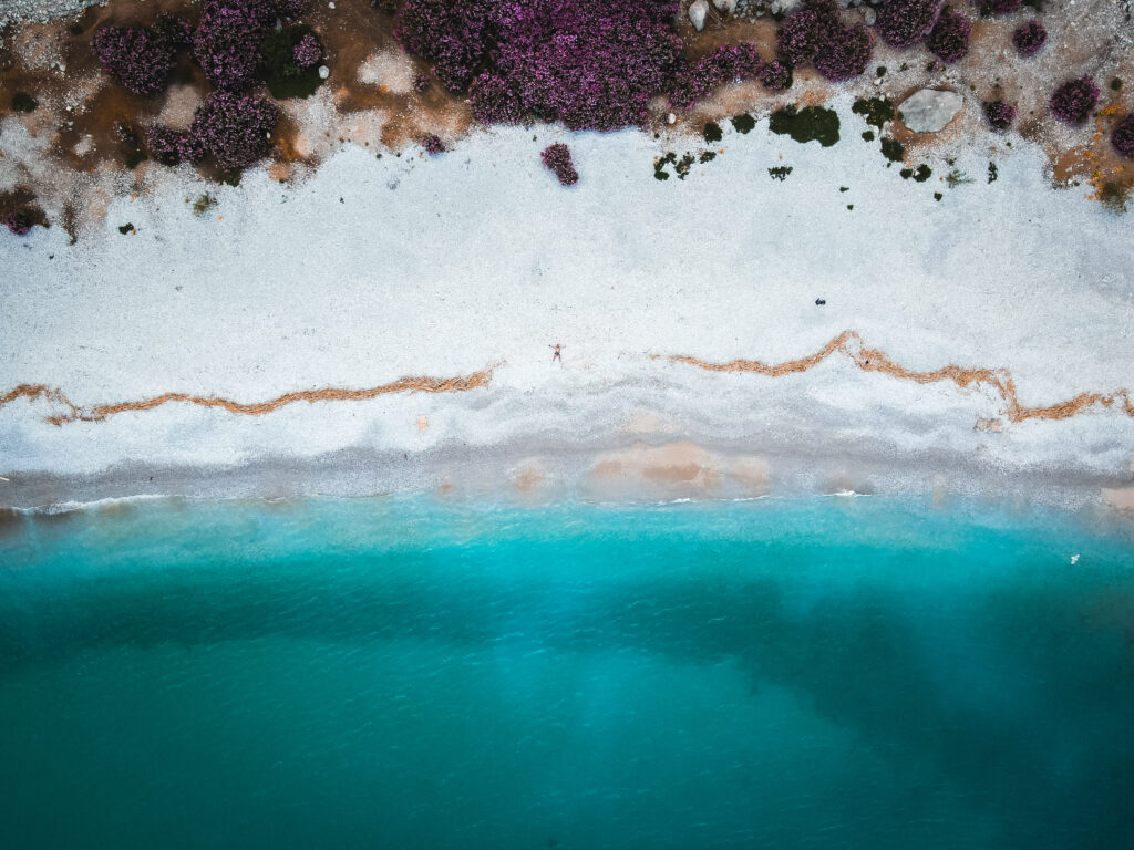 Aerial view of a quiet shoreline and clear water in Symi Island, Greece